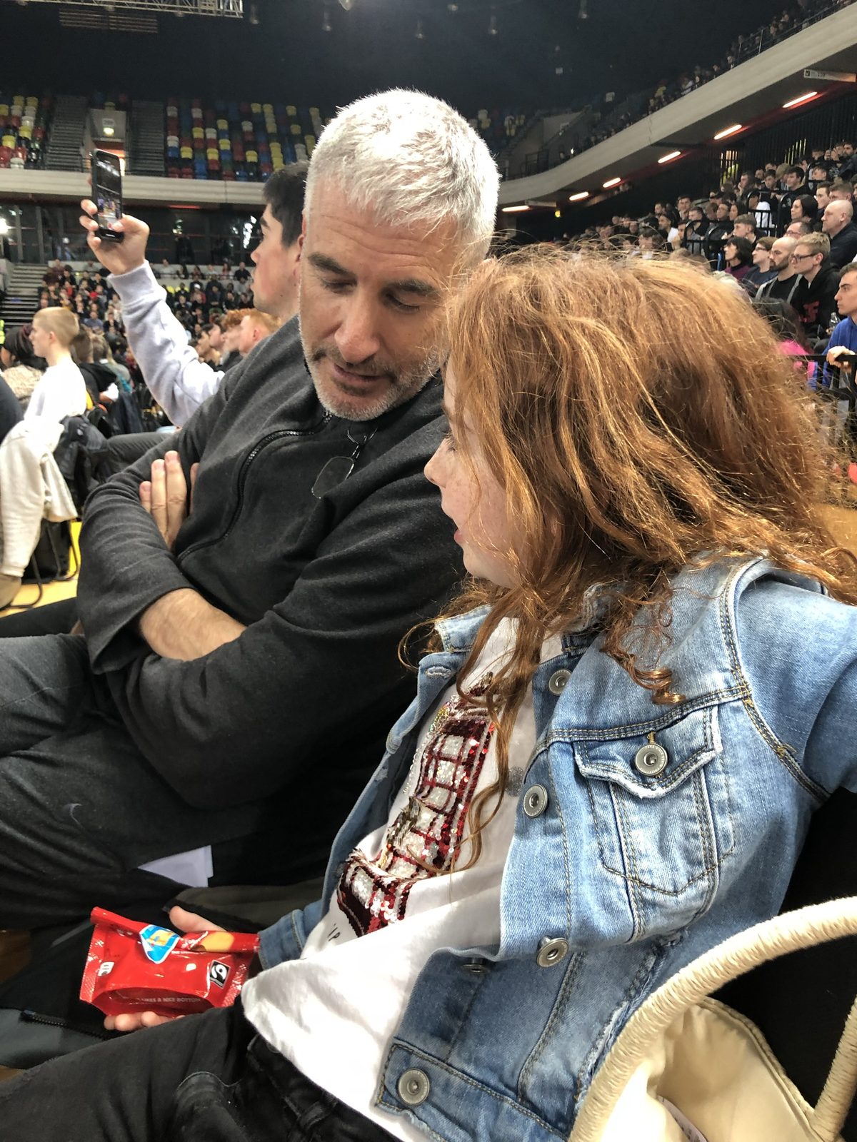 Peter A. Sussman and Alice watching basketball at Olympic Park, London