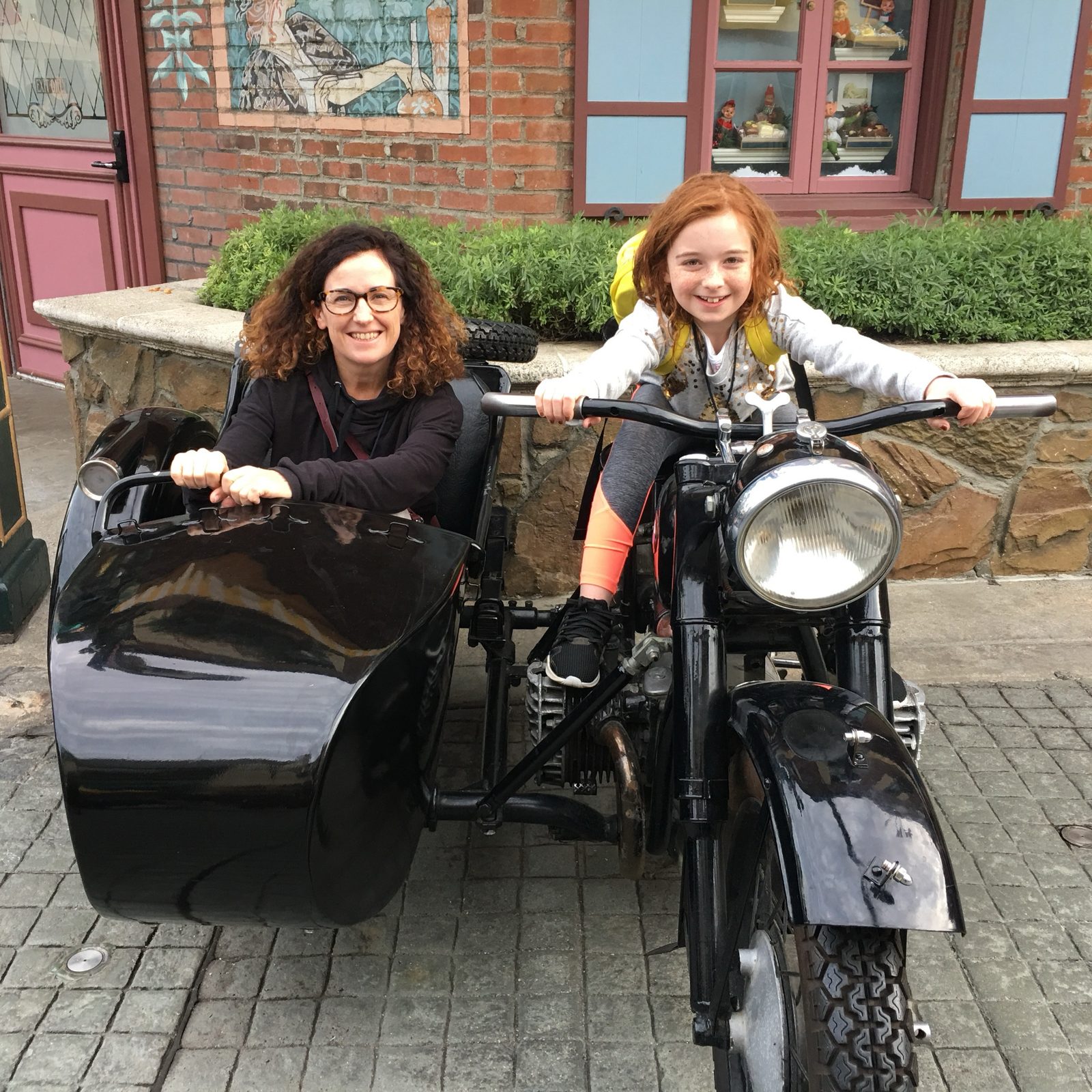 Sara Curran and her daughter Alice on a vintage BMW motorcycle and sidecar at Universal Studios