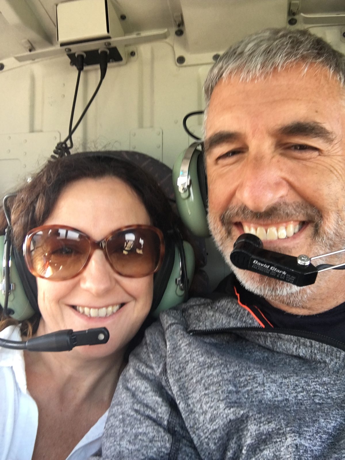Sara Curran and Peter A. Sussman in a helicopter