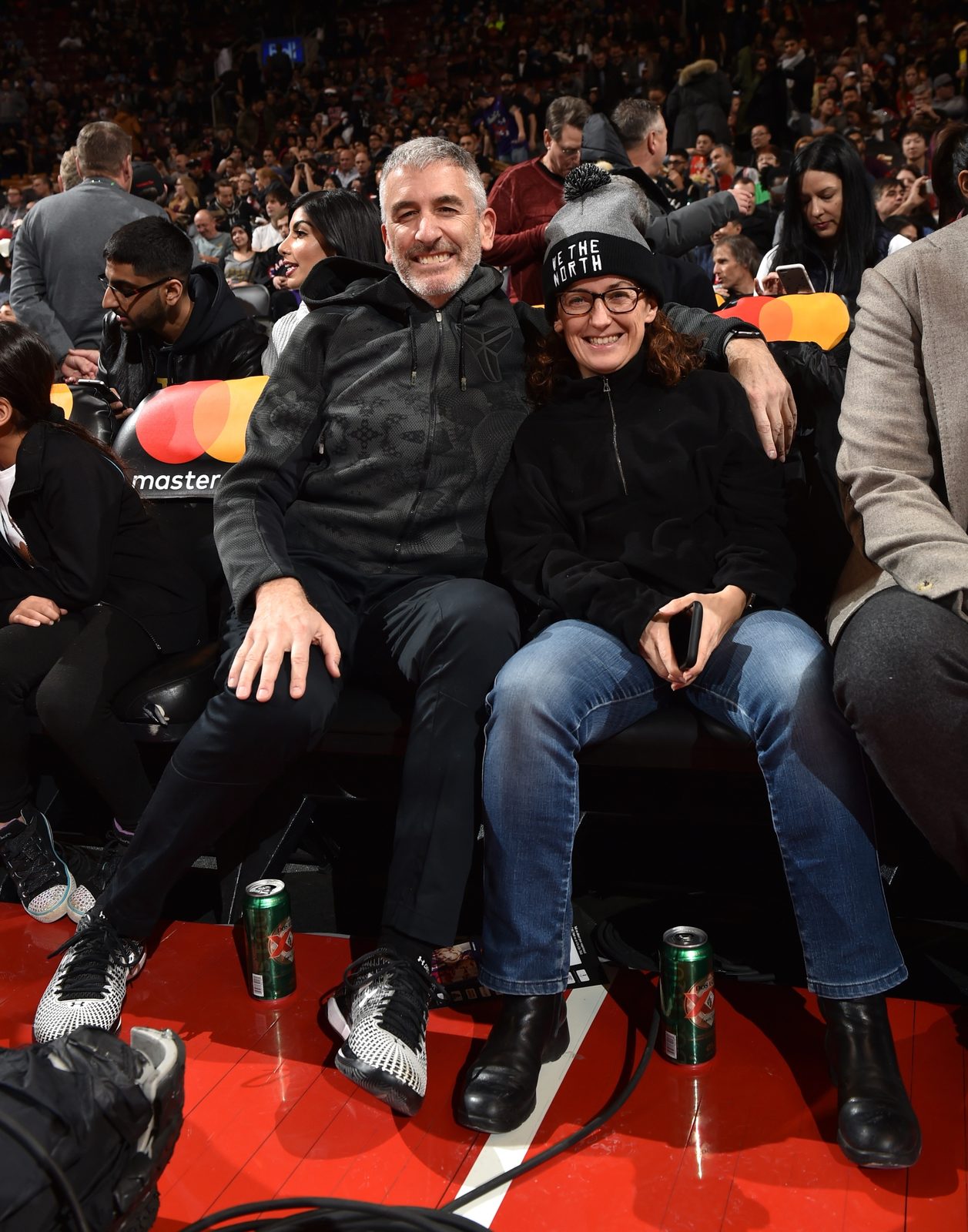 Peter A. Sussman and Sara Curran courtside at a Toronto Raptors game